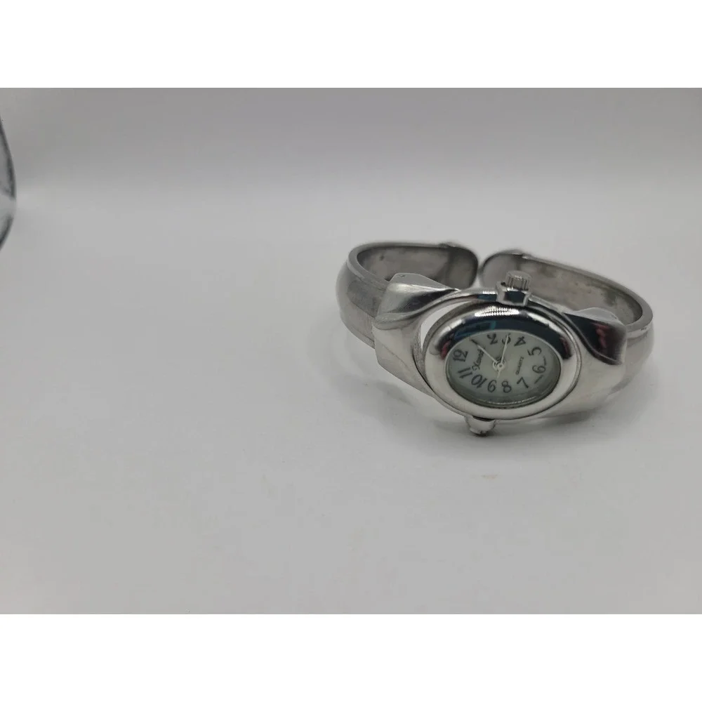 Xanadu Women's Silver Tone Hinged Cuff Bangle Quartz Watch Oval Dial Reverse